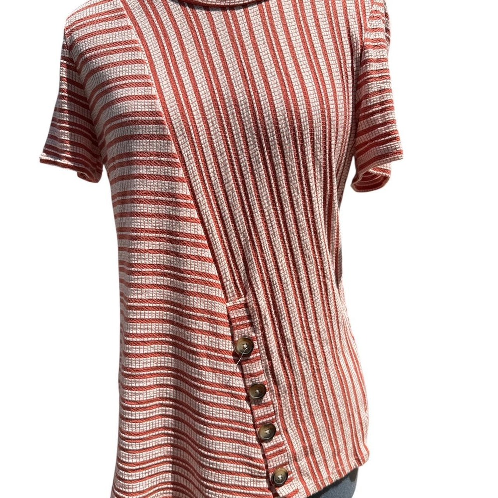 Red orange and white striped short sleeve top with diagonal button accents